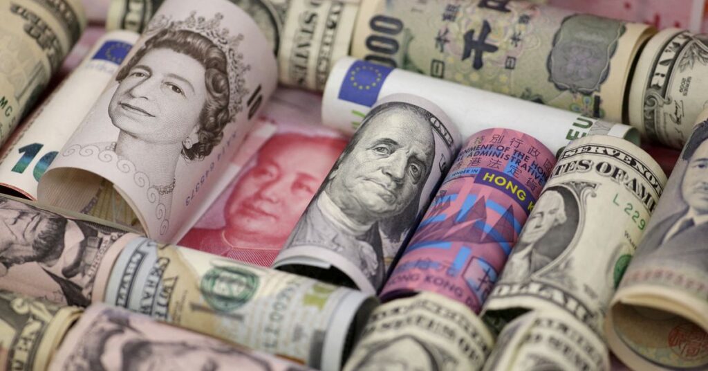 Euro, Hong Kong dollar, U.S. dollar, Japanese yen, British pound and Chinese 100-yuan banknotes are seen in a picture illustration
