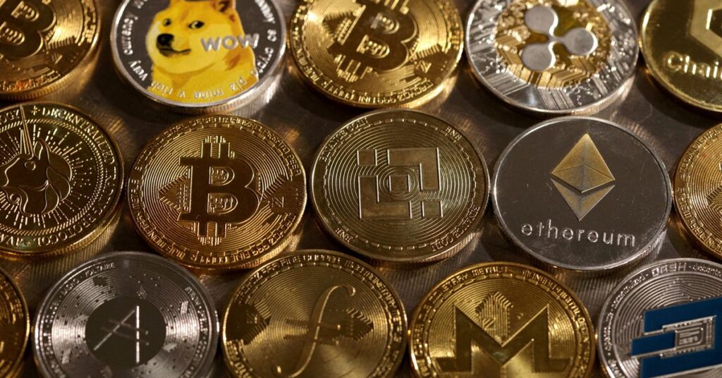 Illustration shows representations of cryptocurrencies