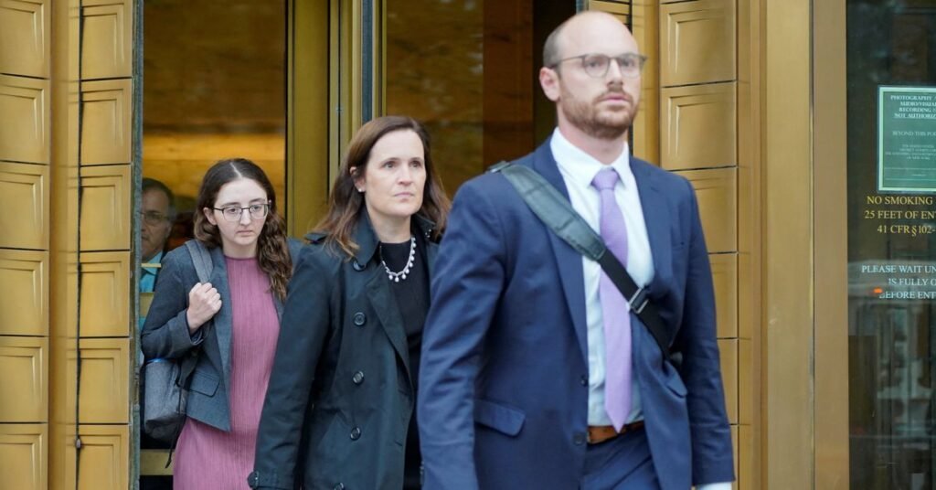 A worker operates equipment on a drilling rig near Midland