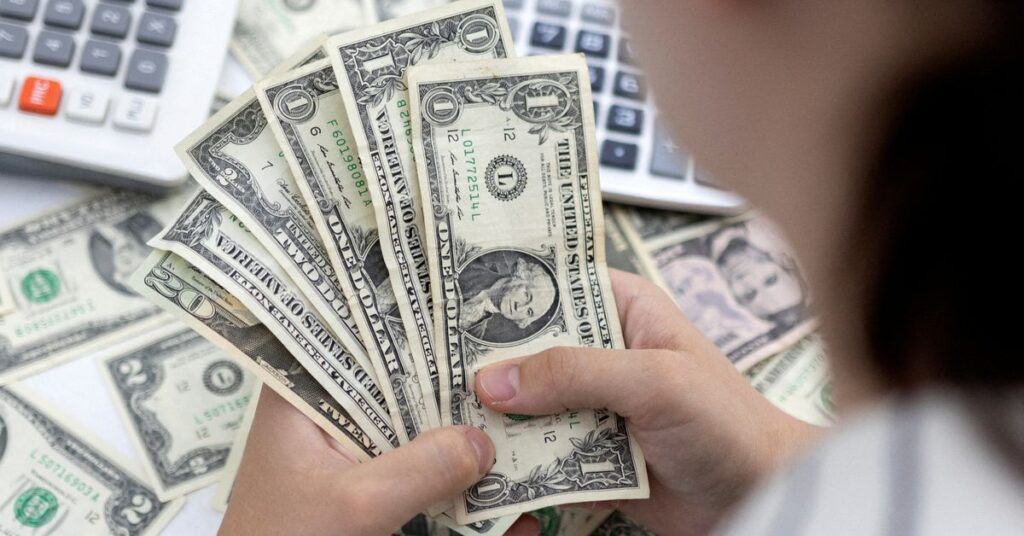 Illustration shows U.S. Dollar banknotes