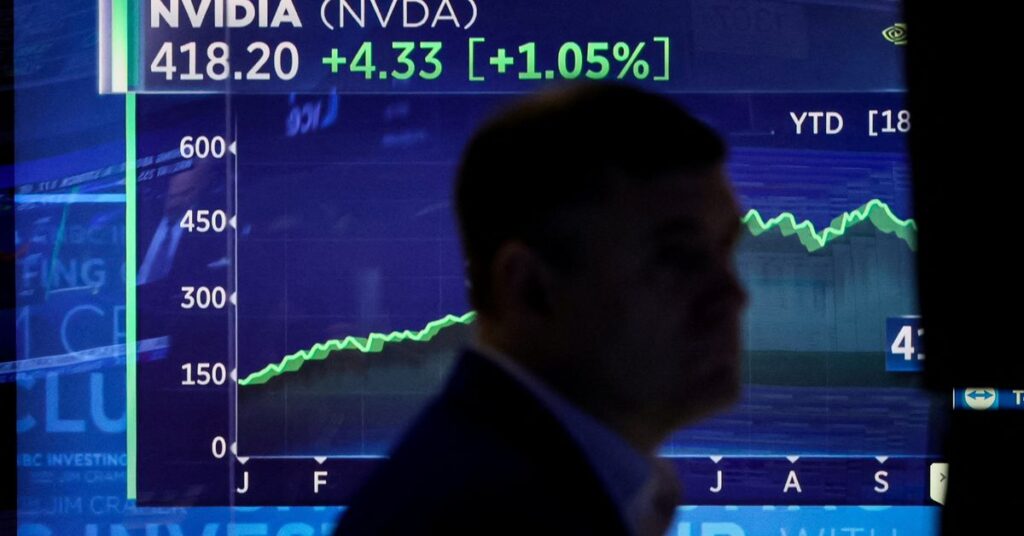 Traders work on the floor of the NYSE in New York