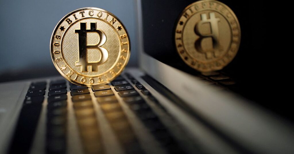 A bitcoin is seen in an illustration picture taken at La Maison du Bitcoin in Paris