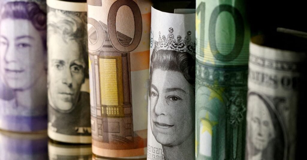Dollar, Euro and Pound banknotes are seen in this picture illustration