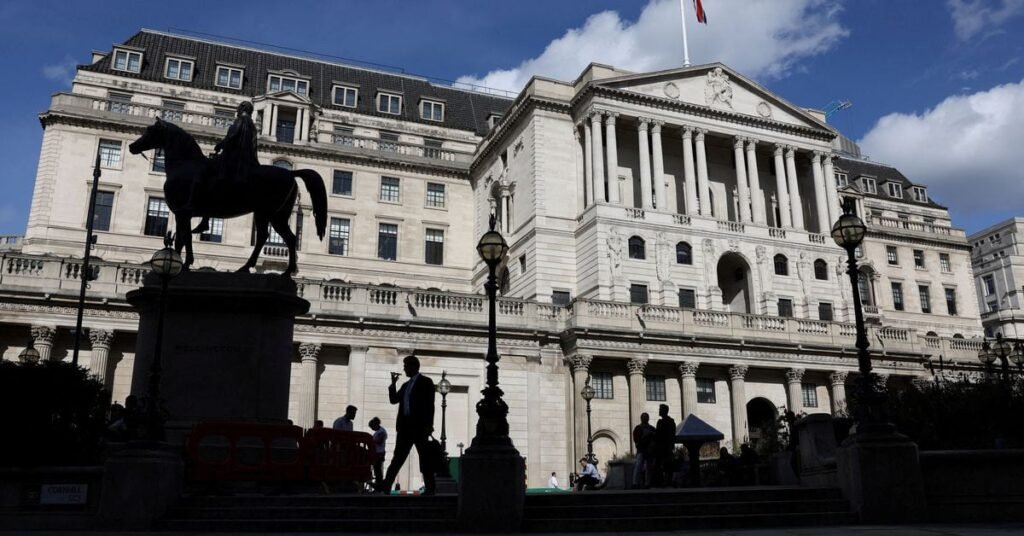 Pedestrian walks past the Bank of England in London