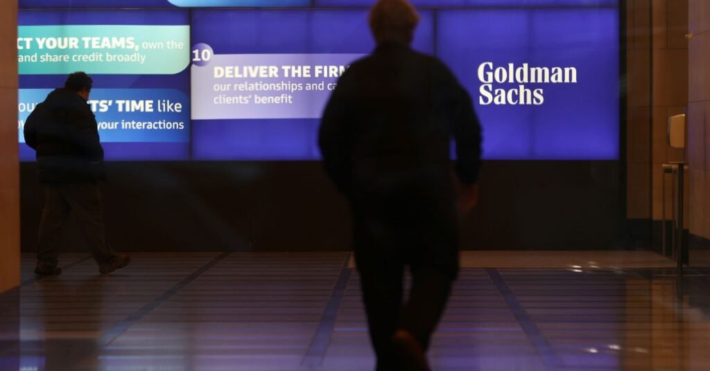 People walk in the Goldman Sachs global headquarters in Manhattan, New York