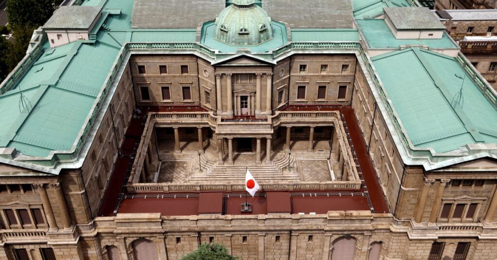 Japanese national flag is hoisted atop the headquarters of Bank of Japan in Tokyo