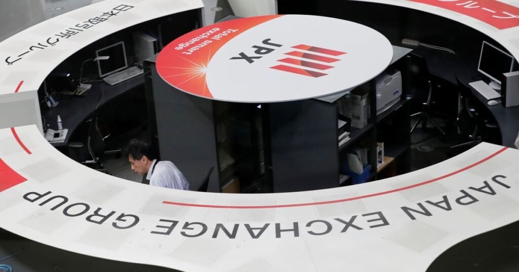 A man works at the Tokyo Stock Exchange after market opens in Tokyo