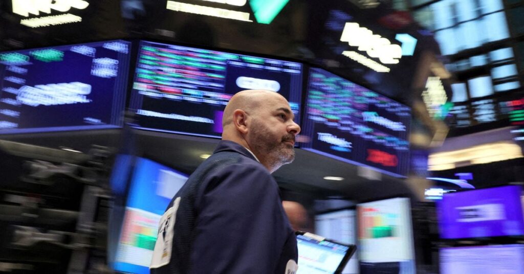 Traders work on the floor of the NYSE in New York